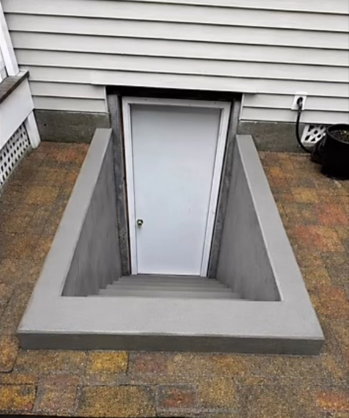 After: raised concrete basement entrance