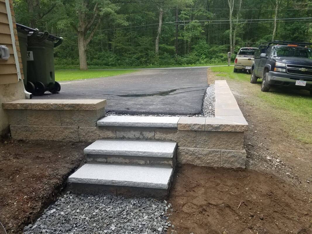 Granite steps set into a block wall