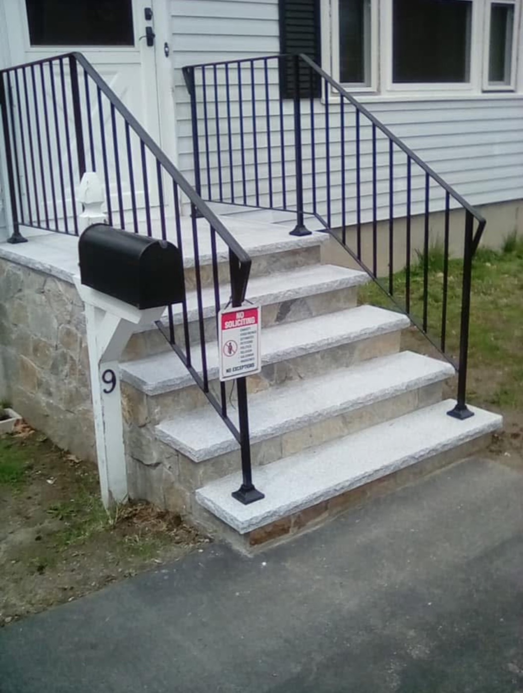 After: granite steps with stone risers and new railings